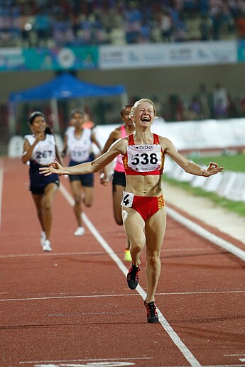 Darya Maslova wins the race Daria Maslova, Gold Medalist Enjoying The Podium Finish In Women 5000m.jpg