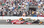 Scott Dixon (#9), takes a victory lap after winning the 2008 Indianapolis 500. Dixon victory lap 2008 Indy 500.jpg