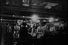 The original Manning's in Pike Place Market, circa 1930s. Employees at Manning's Tea, circa 1930s (48415025852).jpg