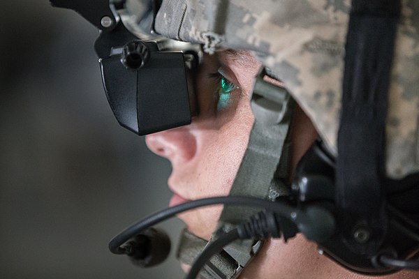 A Missouri National Guardsman looks into a VR training head-mounted display at Fort Leonard Wood in 2015.