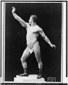 Eugen Sandow, full-length nude portrait, standing, facing left, right arm r...