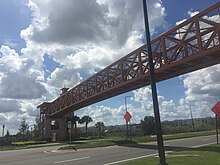 A skywalk across Western Way at Flamingo Crossings. Flamingo Crossings Skywalk.jpg