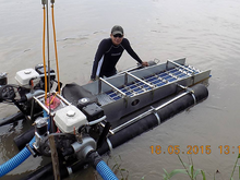 Professional gold miner using an advanced dredge system. Sumatra. Indonesia. May 2015. Gold Dredge in Indonesia. Sumatra. May 2015.png