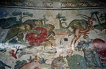 The Great Hunt; floor from the villa at Piazza Armerina, Sicily ca. 320. Figures are about life-size. Great Hunt mosaics, Villa del Casale, by Jerzy Strzelecki.jpg