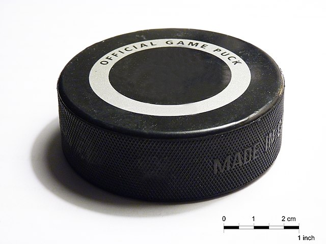 A standard ice hockey puck
