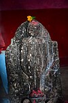 Jain Statue worshipped as deity inside Dharmaraj temple at Sankra.jpg