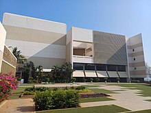 Facade of an auditorium with open garden space in front