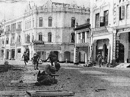 Japanese troops advancing up High Street (now Jalan Tun H S Lee) in Kuala Lumpur in December 1941 during World War II.