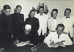 Tito and Jawaharlal Nehru, Prime Minister of India, signing the Joint Declaration after the conclusion of their talks, c. 1955