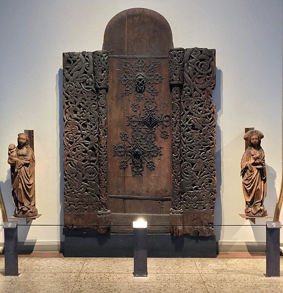 File:Kulturhistorisk Museum, Oslo, Norway. Stave chruch portal (stavkirkeportal) from Fåberg Stave Church, Oppland. Wooden sculptures. Photo 2017-12-14.jpg