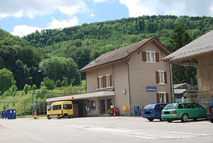 Three-story building with gabled roof