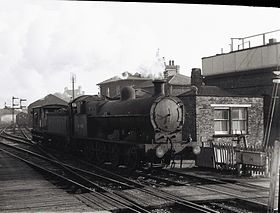 An LNWR 0-8-0 49403 leaves Leighton Buzzard railway station for the Dunstable branch Leighton Buzzard station with 49403.JPG