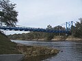 Carrying SR 51 across the Suwannee River, the border between Suwannee and Lafayette counties. Looking west from the boat ramp in the park near the bridge.