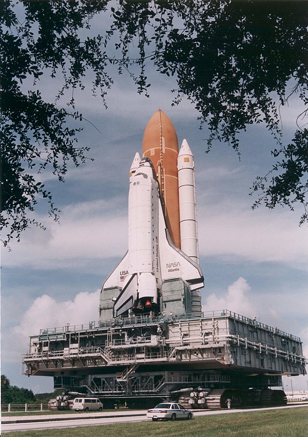 The Space Shuttle Atlantis is carried atop the MLP-1 in the lead-up to STS-79