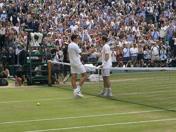 Andy Murray shakes hands with Milos Raonic at the completion of the men's singles final.