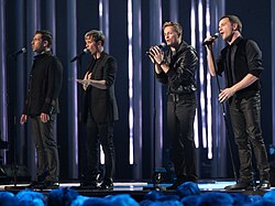 Westlife (from left-to-right: Feehily, Egan, Byrne, Filan) performing in 2009