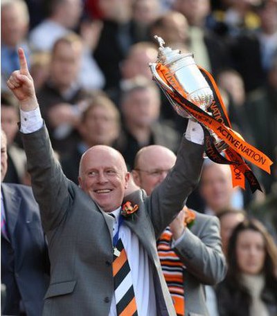 Manager Peter Houston celebrating Dundee United's 2010 Scottish Cup Final win