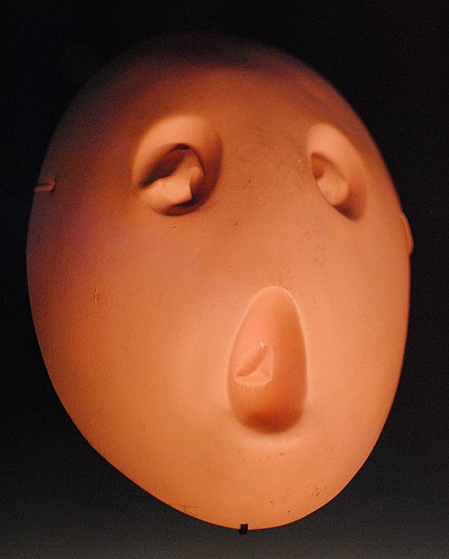 Blank of a mask worn by children in the classroom scenes; displayed at the Pink Floyd: Their Mortal Remains exhibition.