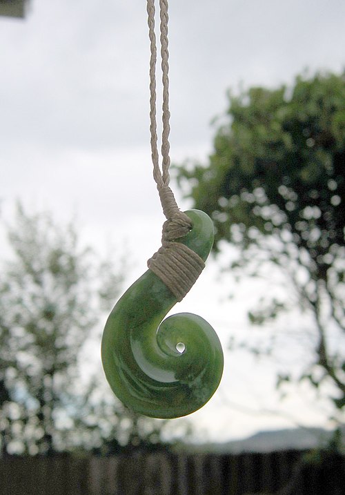 Pounamu hei matau pendant, a heavily stylized fishhook