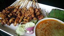 A Satay being served in Singapore. Quintessentially Javanese in origin, the dish is now known as part and parcel of Singaporean Malay cuisine, reflecting the visible Javanese ancestry of many Malays in the republic. Satay 2.jpg