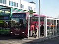 Southern Vectis 595 Mill Bay (R813 NUD), a Volvo B10M-62/Plaxton Premiere 350, in Newport, Isle of Wight bus station on route 1. Roadworks along Horsebridge Hill were causing large delays for buses on route 1, so additional vehicles were used to maintain frequency, which is why a coach is seen operating the route.