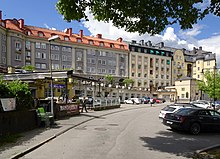 Strandgatan street with several large residential buildings drawn by Tore E:son Lindhberg in the 1920s