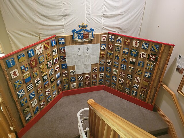 Tableau des armoiries des seigneurs et gouverneurs de l'Acadie, au musée des cultures fondatrices de Grande-Anse.