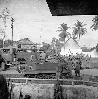 Troops of the 26th Indian Division unload material from their vehicles just outside Medan in Sumatra. The Allied Occupation of Sumatra SE7515.jpg