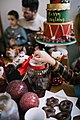 The boy opens a glass bowl with cakes (49170430062).jpg