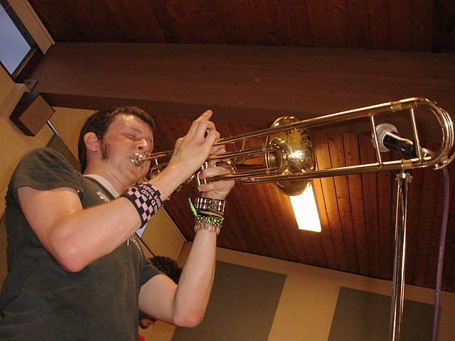 Former trombonist of ska punk band We Are the Union performs on a valve trombone