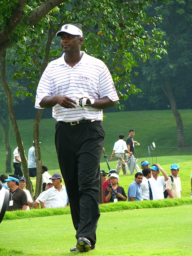 Vijay Singh walking.