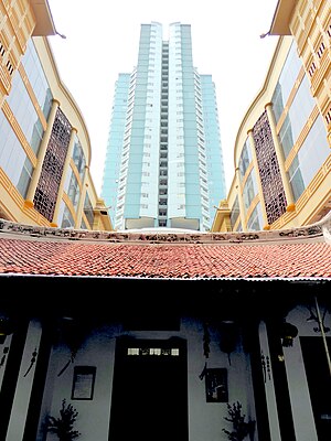 In the restored part of Candra Naya, the Green Central City superblock dominates the background where the private rear building used to stand. 004 Skyscraper Overhead (23460350716).jpg