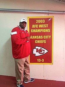 Hall next to the 2003 Kansas City Chiefs division championship banner 2003 AFC Champion Banner.jpg