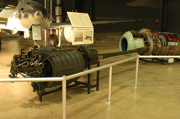 German BK 5 50 mm aircraft autocannon displayed in front of the Me 262A jet, a design once tested with it