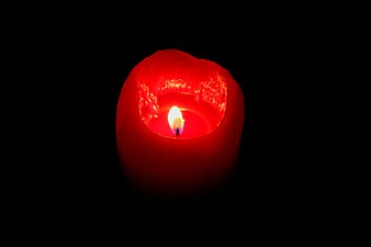 A red candle in the dark