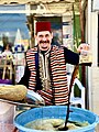 A refugee man selling licorice