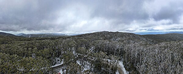 Aerial panorama of Mount Donna Buang. Flurry of snow in early spring. Shot on 9 September 2023.