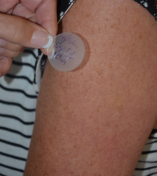 A transdermal patch which delivers medication is applied to the skin. The patch is labelled with the time and date of administration as well as the ad