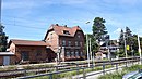 Schönwalde station, consisting of a reception building with signal box annex, connecting structure, goods shed, toilet building and platform, paved station forecourt and paving stones on the buildings