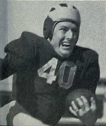 Nussbaumer rushing with a football in uniform