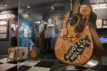 Buddy Holly's Gibson J-45 with leather cover - "Ladies and Gentlemen... the Beatles!" exhibit at LBJ Presidential Library, Austin, TX, 2015-06-23 16.12.04.jpg