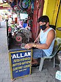 Bulakenyo vaciador grinder wearing protective masks with electric fan sharpening knives and tools 02