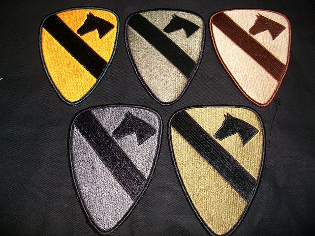 Example of the five current types of shoulder sleeve insignia for the U.S. 1st Cavalry Division; full color, BDU subdued, desert subdued, UCP subdued,