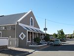 Long and high saddle roofed building with gable end, gables are triangular with shoulders, mock chim Type of site: Masonic Hall Current use: Residential : House. Intrinsic aesthetic/architectural merit Carnarvon 10 Daniel St.JPG