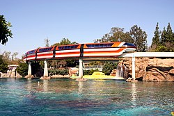 Monorail Orange, a Mark VII (Mk7) monorail, passes over the lagoon in Tomorrowland at Disneyland. Dlp nemo lagoon.jpg