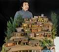 Dr. Niccu Tafarrodi with diorama titled "Hill City", inspired by the village of Masuleh, Iran.jpg