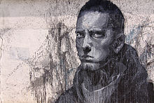 Large graffiti picture of a serious-looking Eminem