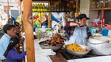 Customers at a market for food in Cajamarca, Peru Food Market at Cajamarca, Peru.jpg