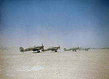 Hawker Hurricanes Mark IIDs on a Tunisian airfield, preparing for a ground attack mission, April 1943. Hawker Hurricane Mark IID 'tank busters' of No. 6 Squadron about to take off from Gabes in Tunisia, 6 April 1943. TR869.jpg