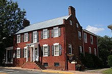 The Dr. Holladay House in Orange, Virginia. The original brick house (ca. 1830) was a Federal-style I-House. Holladay house 2007.jpg